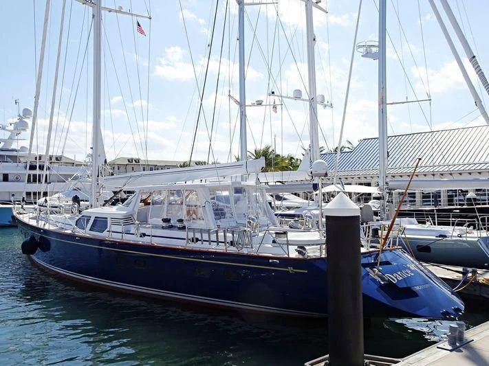 a boat docked at a pier aboard DANCE SMARTLY Yacht for Sale