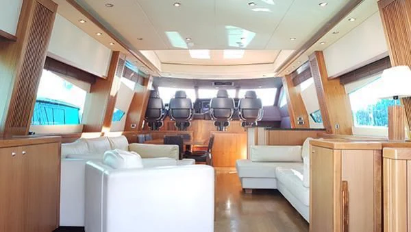 a living room with a couch and a table aboard LAURA S Yacht for Sale