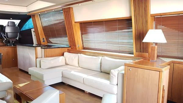 a living room with a white couch aboard LAURA S Yacht for Sale