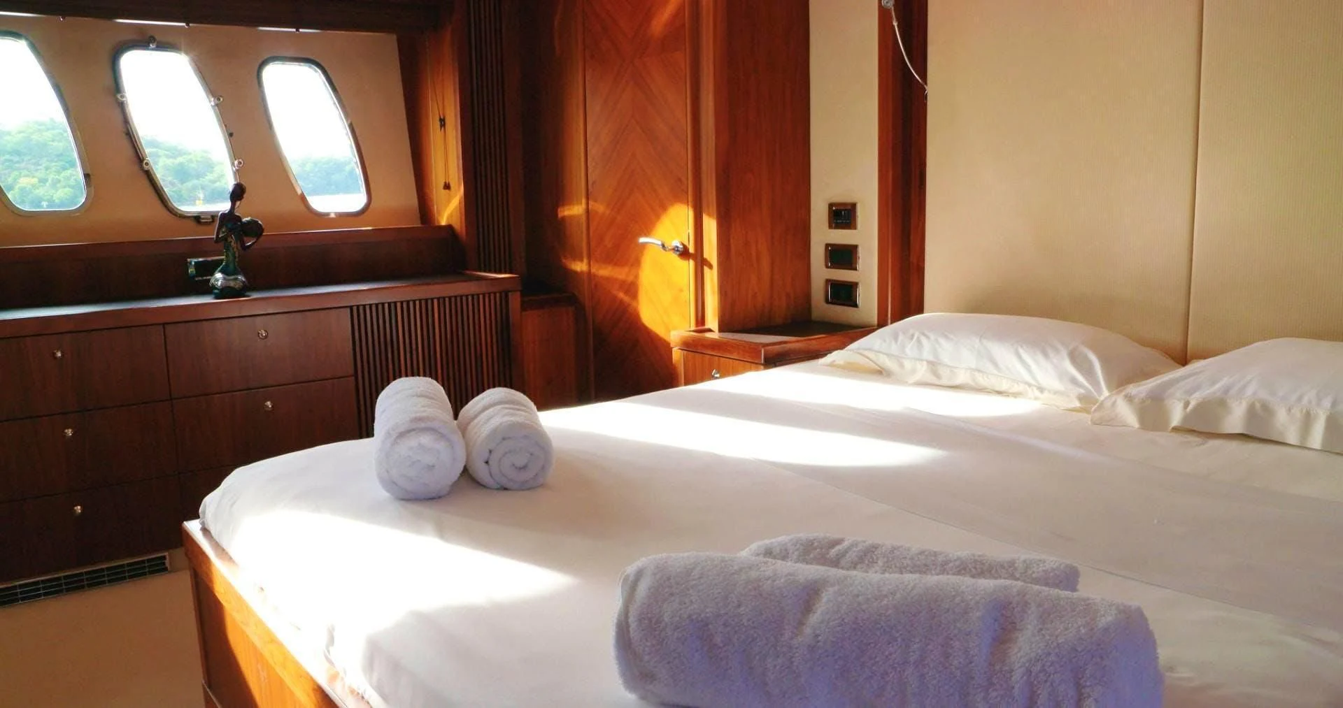 a room with a bed and a window aboard LAURA S Yacht for Sale