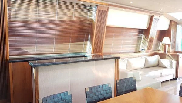 a room with a couch and a table aboard LAURA S Yacht for Sale