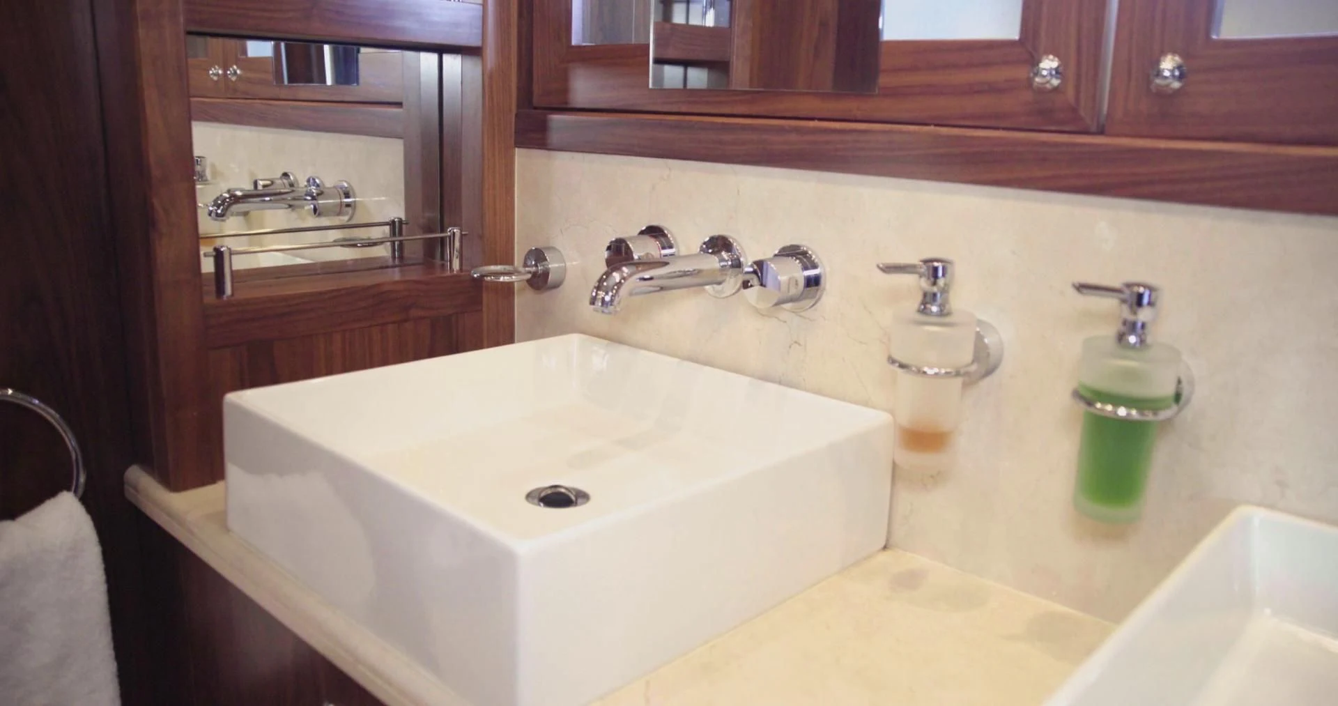 a sink and a mirror in a bathroom aboard LAURA S Yacht for Sale