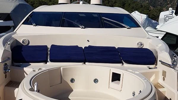 a row of white cars aboard LAURA S Yacht for Sale