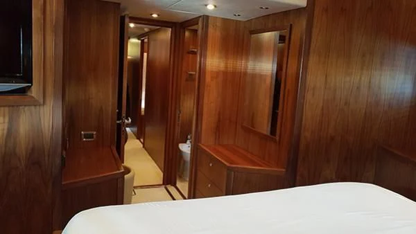 a room with wooden walls aboard LAURA S Yacht for Sale