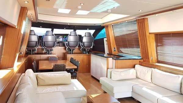 a room with couches and a table aboard LAURA S Yacht for Sale