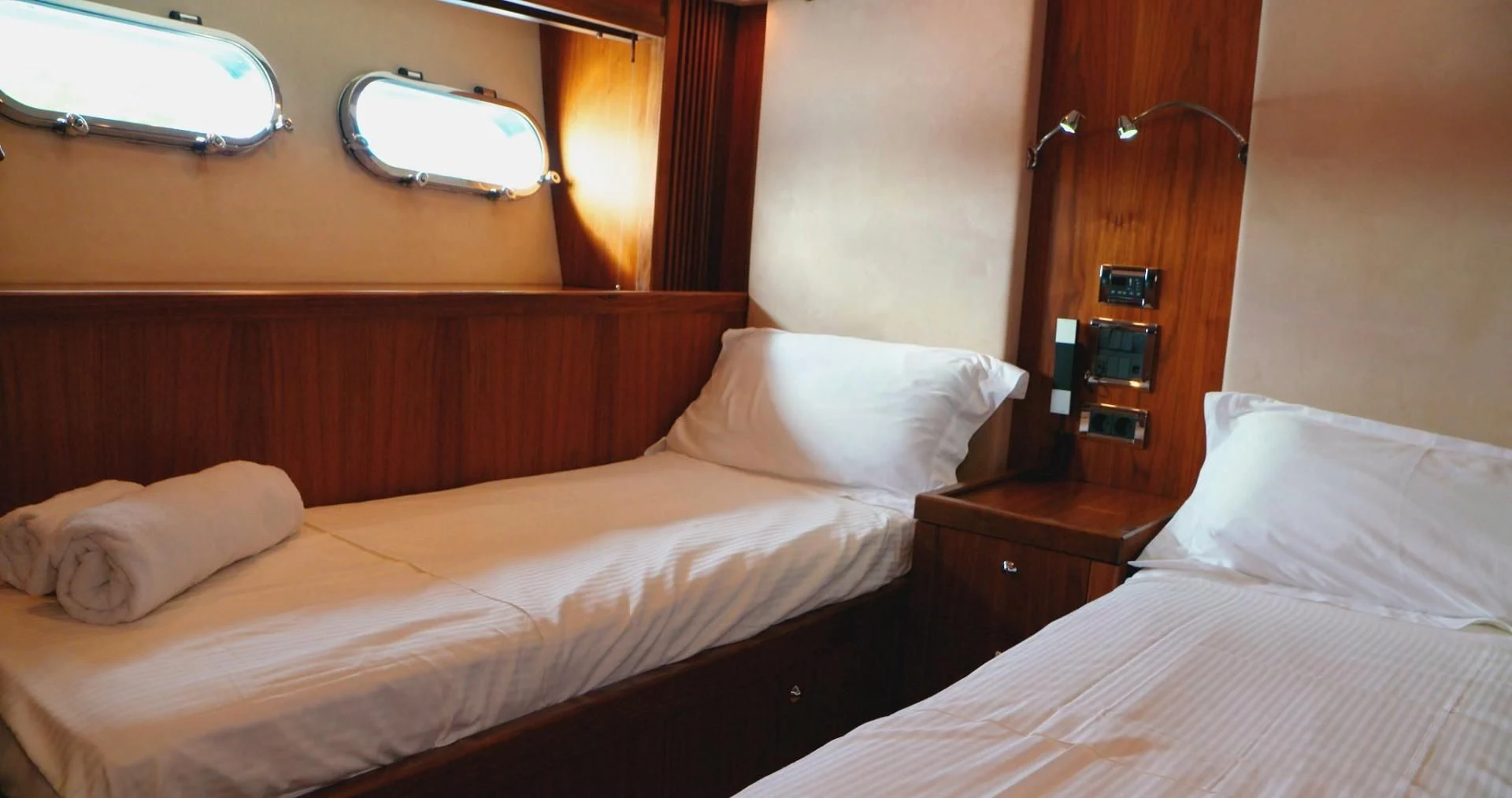 a couple of beds in a hotel room aboard LAURA S Yacht for Sale