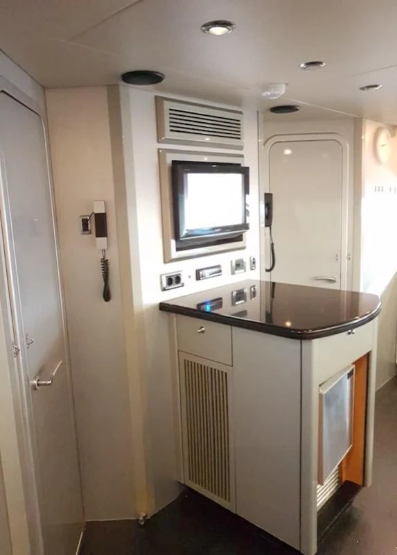 a kitchen with a sink and a tv aboard LAURA S Yacht for Sale
