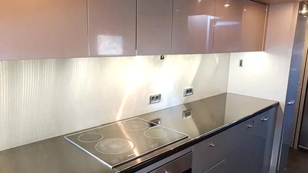 a kitchen with a sink and cabinets aboard LAURA S Yacht for Sale