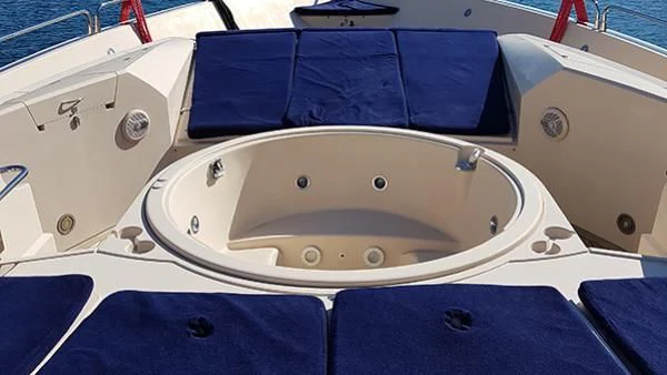 a white boat with blue seats aboard LAURA S Yacht for Sale