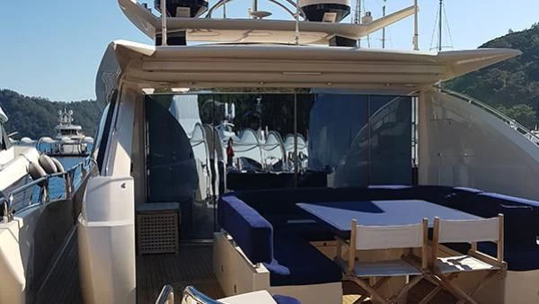 a boat with chairs and tables aboard LAURA S Yacht for Sale
