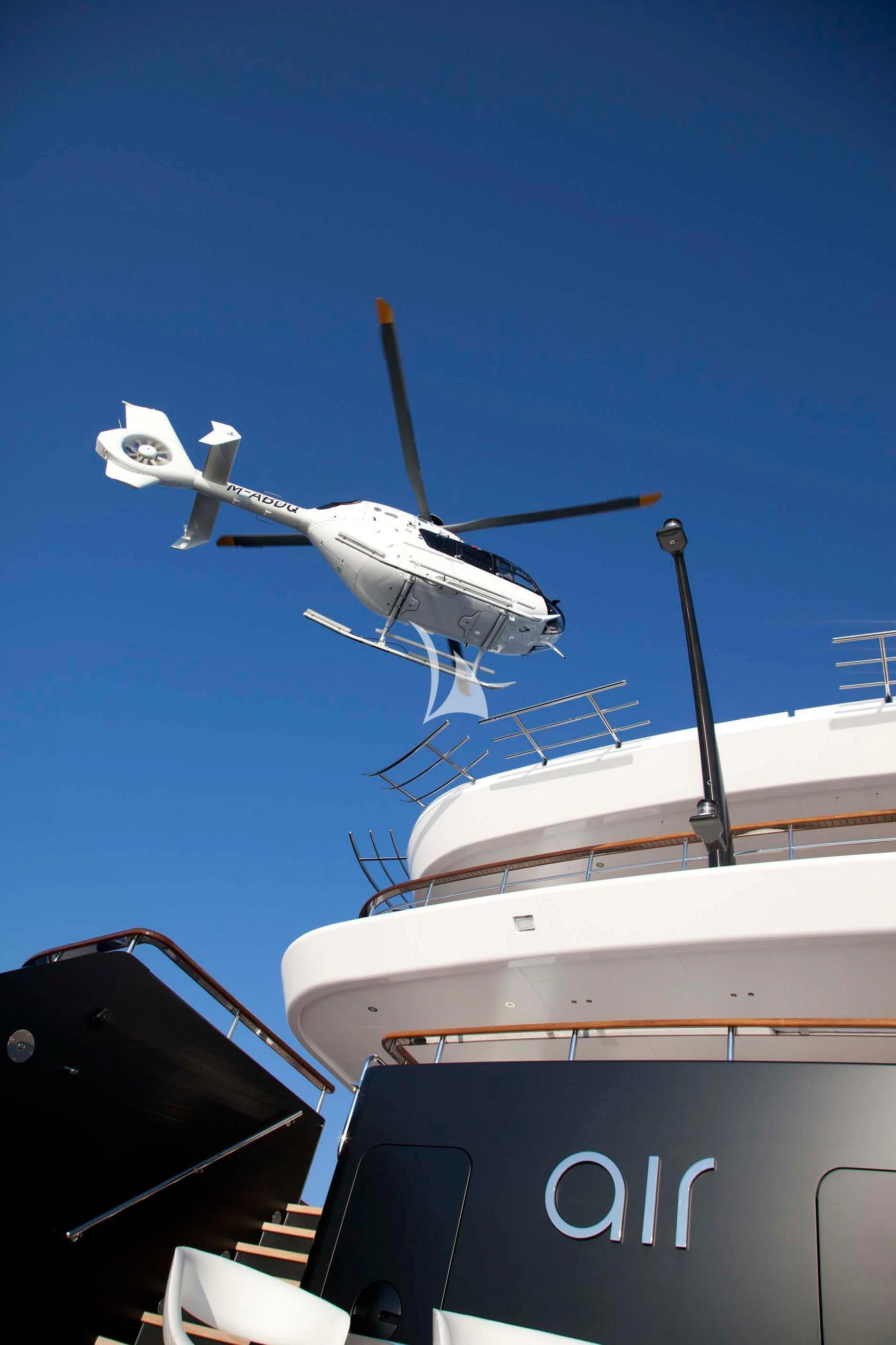 a plane flying over a boat aboard AIR Yacht for Sale