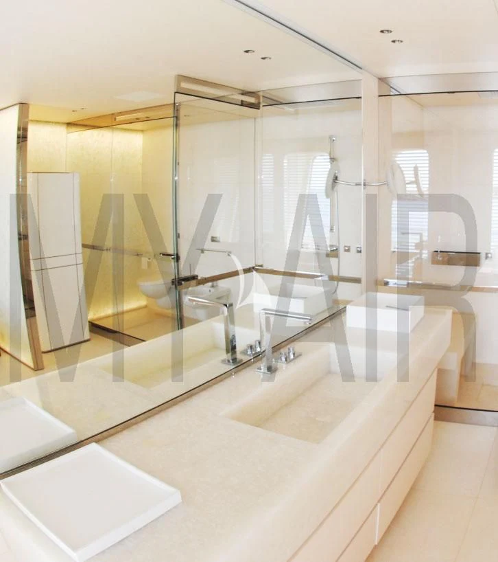 a bathroom with a large mirror aboard AIR Yacht for Sale