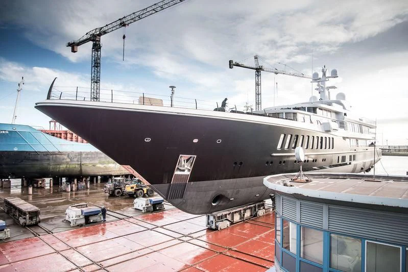 a large ship docked at a port aboard AIR Yacht for Sale