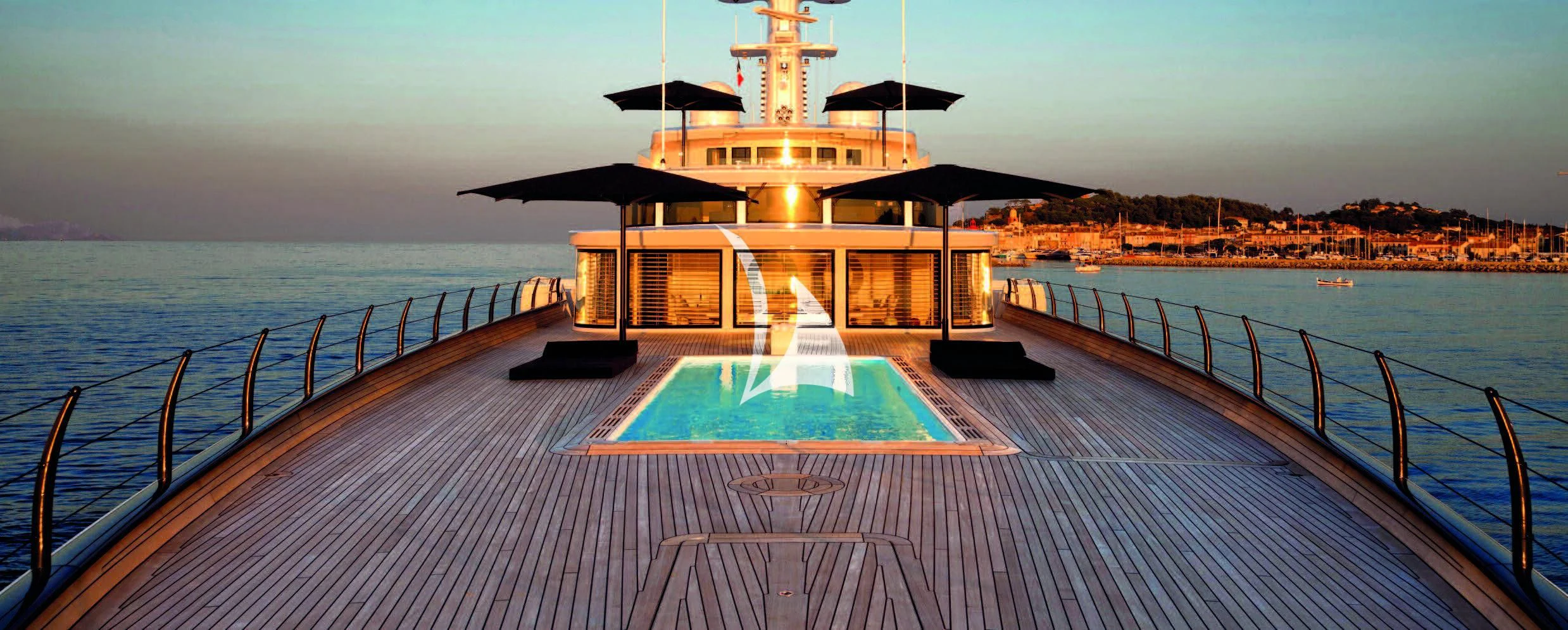 a pool next to a building aboard AIR Yacht for Sale