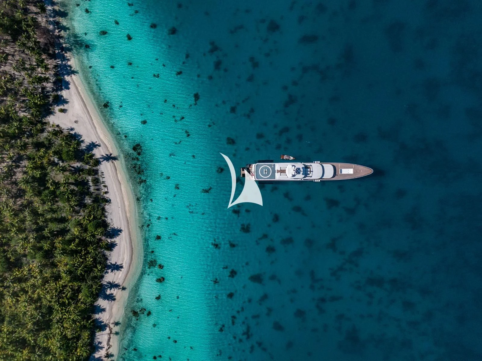 a small white boat in the water aboard AIR Yacht for Sale