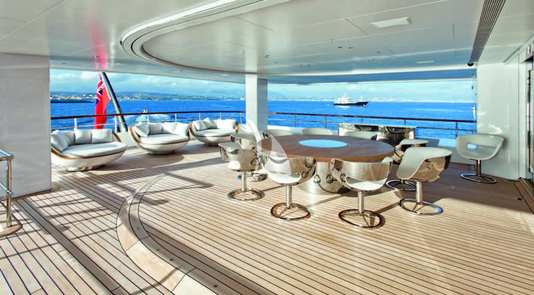 a room with a table and chairs aboard AIR Yacht for Sale