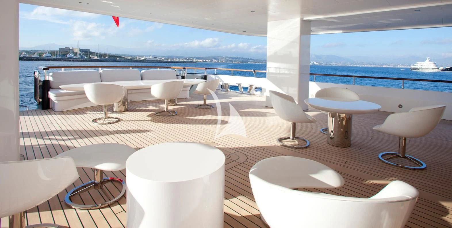 a room with chairs and tables aboard AIR Yacht for Sale