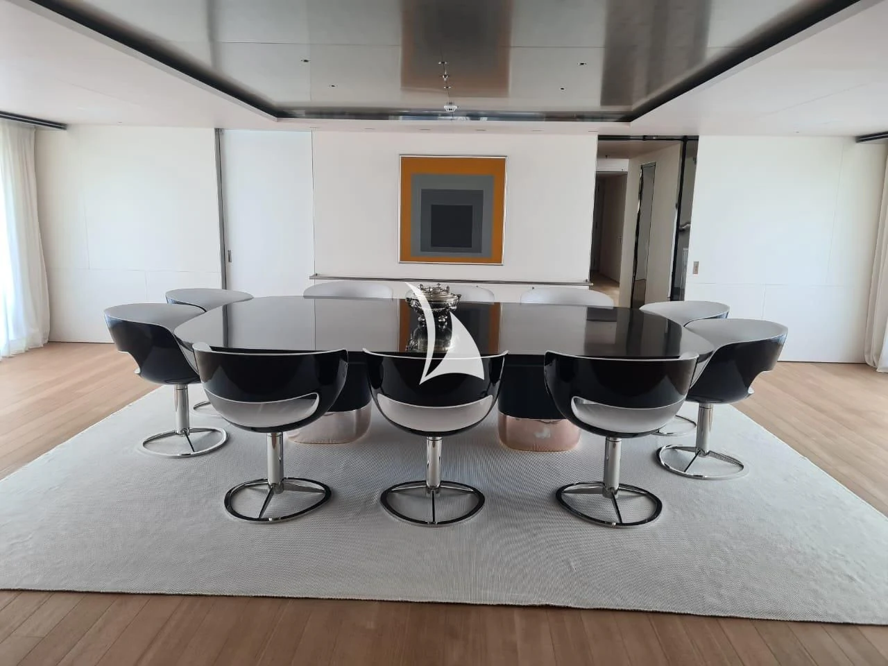 a group of black and white chairs aboard AIR Yacht for Sale