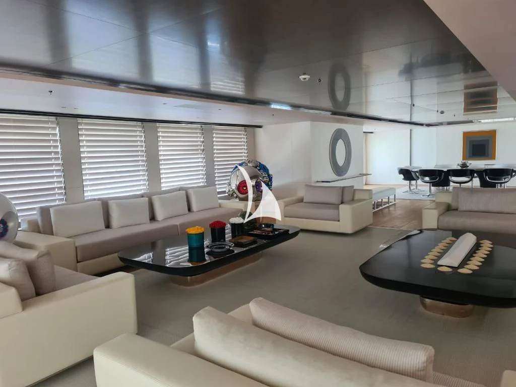 a living room with a couch and a coffee table aboard AIR Yacht for Sale