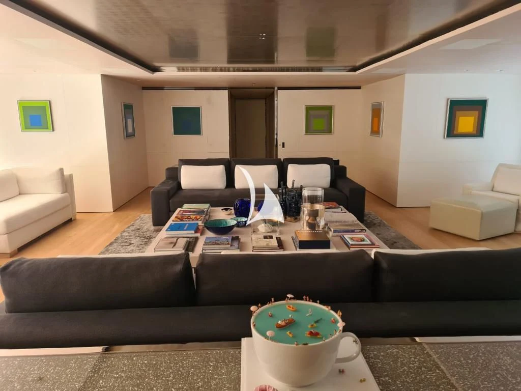 a living room with a couch and a coffee table aboard AIR Yacht for Sale