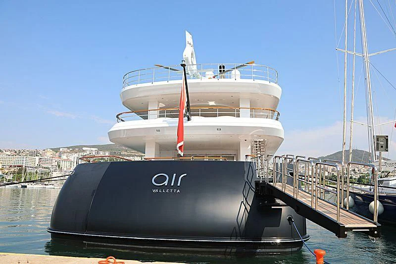 a boat docked at a pier aboard AIR Yacht for Sale