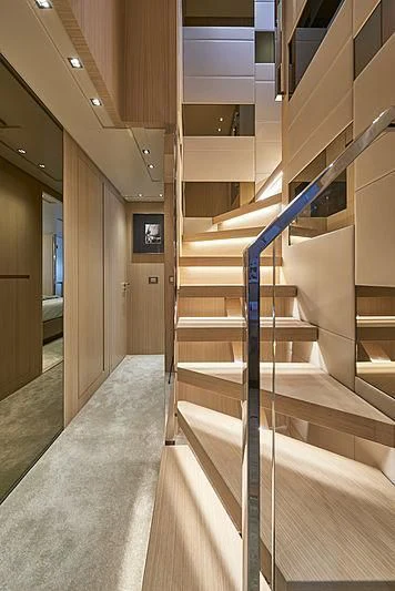 a hallway with a metal railing aboard GI1 Yacht for Sale