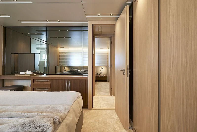 a room with a bed and a desk aboard GI1 Yacht for Sale