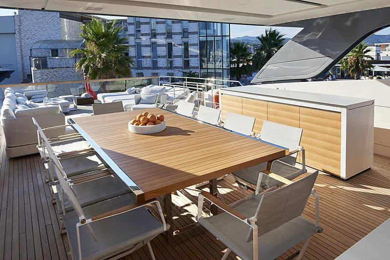 a table with chairs around it aboard GI1 Yacht for Sale