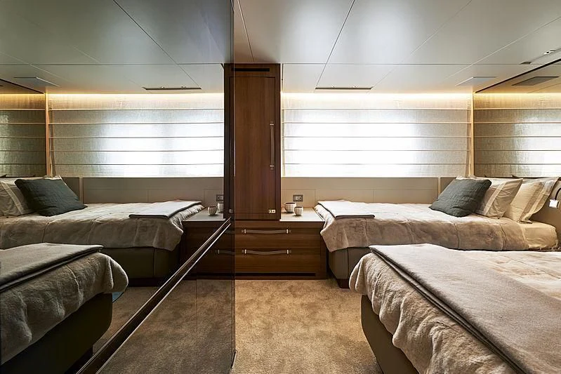 a room with two beds aboard GI1 Yacht for Sale