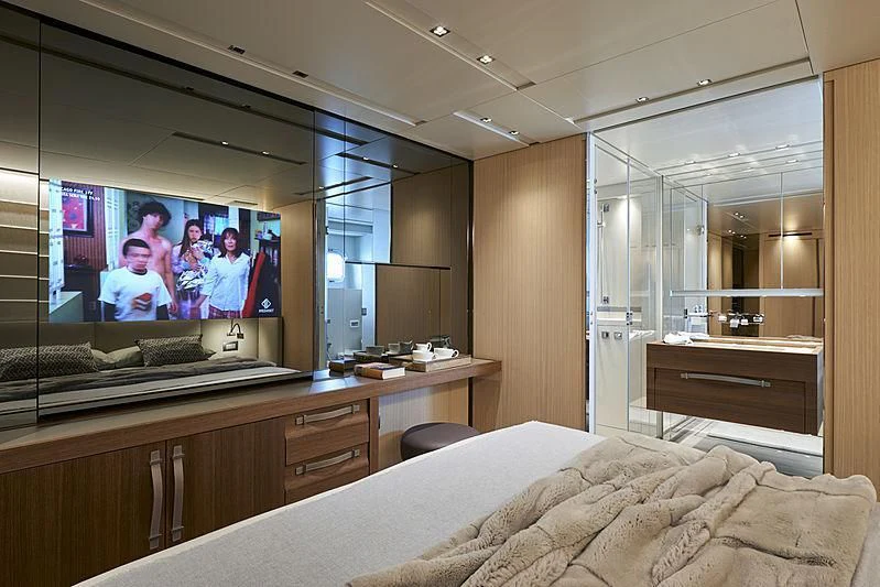 a room with a tv and a bed aboard GI1 Yacht for Sale