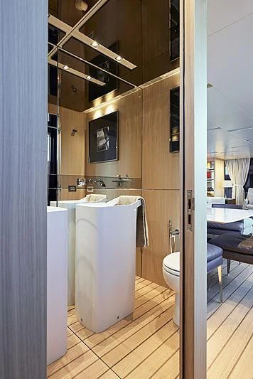 a bathroom with a large mirror aboard GI1 Yacht for Sale