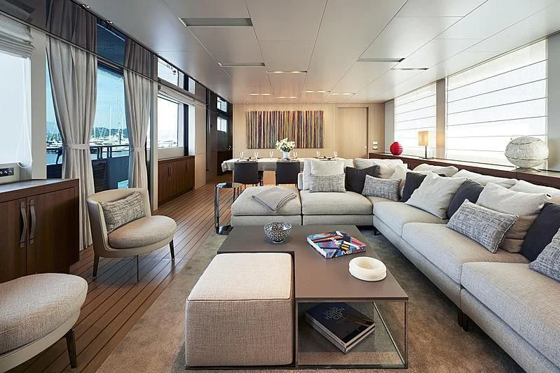a living room with a couch and a coffee table aboard GI1 Yacht for Sale