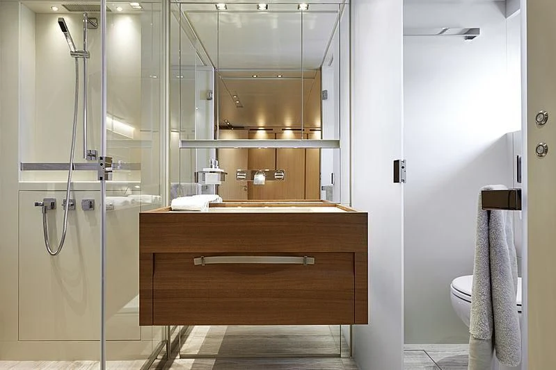 a bathroom with a glass shower aboard GI1 Yacht for Sale