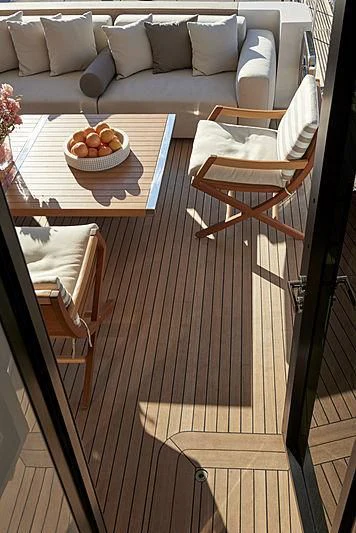 a table with a bowl of fruit on it aboard GI1 Yacht for Sale
