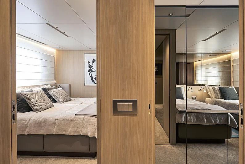 a room with a bed and a door aboard GI1 Yacht for Sale