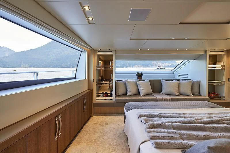 a room with a bed and a window aboard GI1 Yacht for Sale