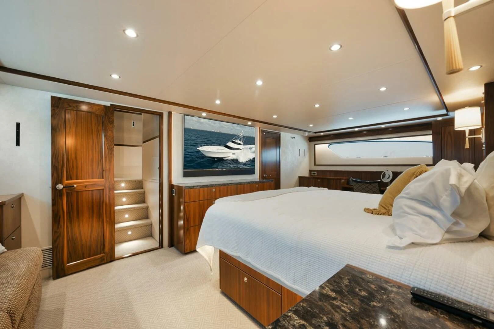 a bedroom with a bed and a wood closet aboard BELLA DONNA DI Yacht for Sale