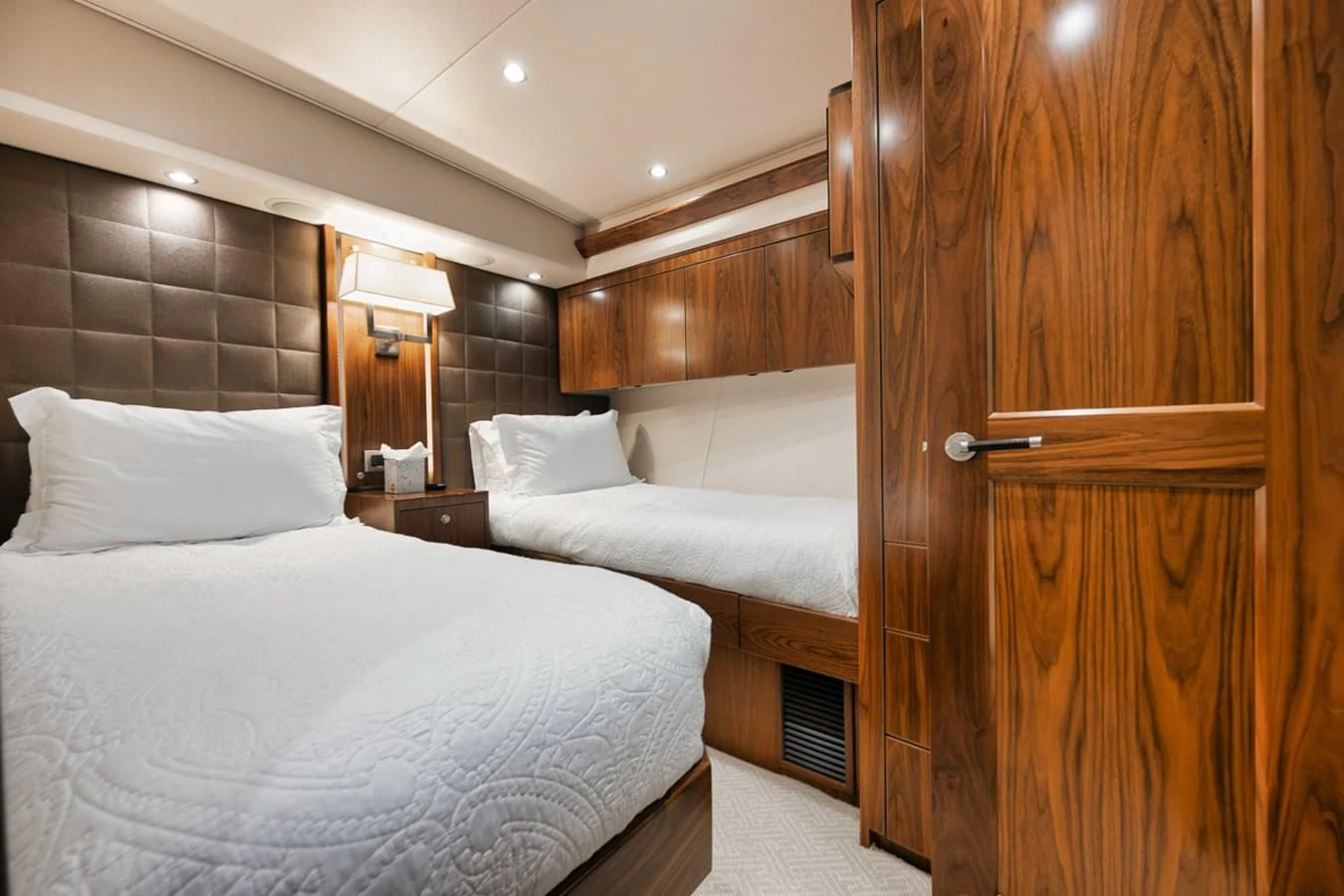 a room with a bed and a wood cabinet aboard BELLA DONNA DI Yacht for Sale