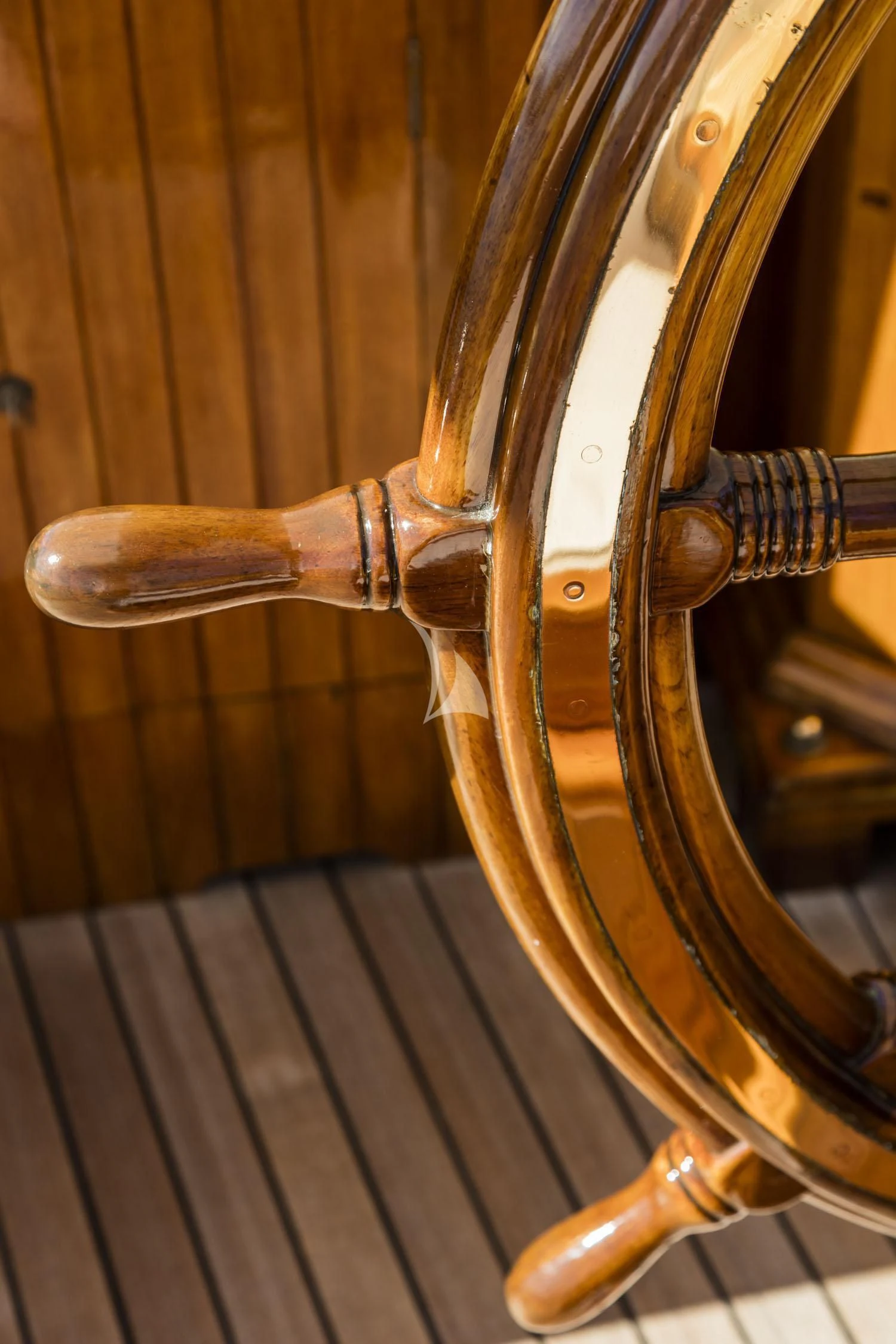 a wooden gavel on a wooden table aboard CROCE DEL SUD Yacht for Sale