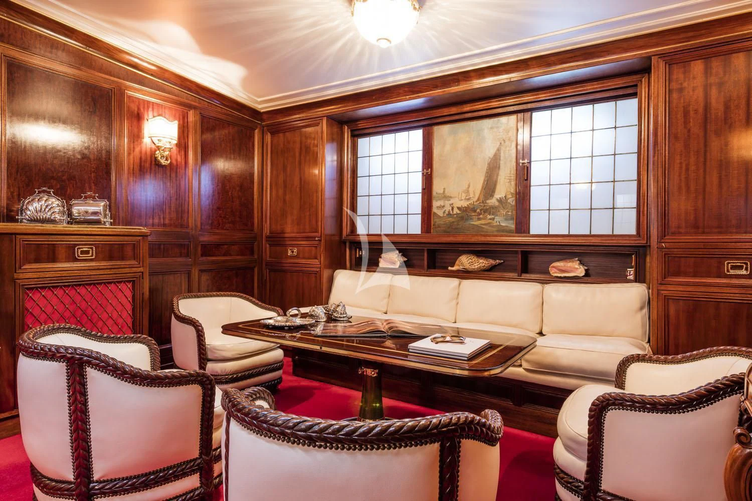 a living room with a couch and a table aboard CROCE DEL SUD Yacht for Sale