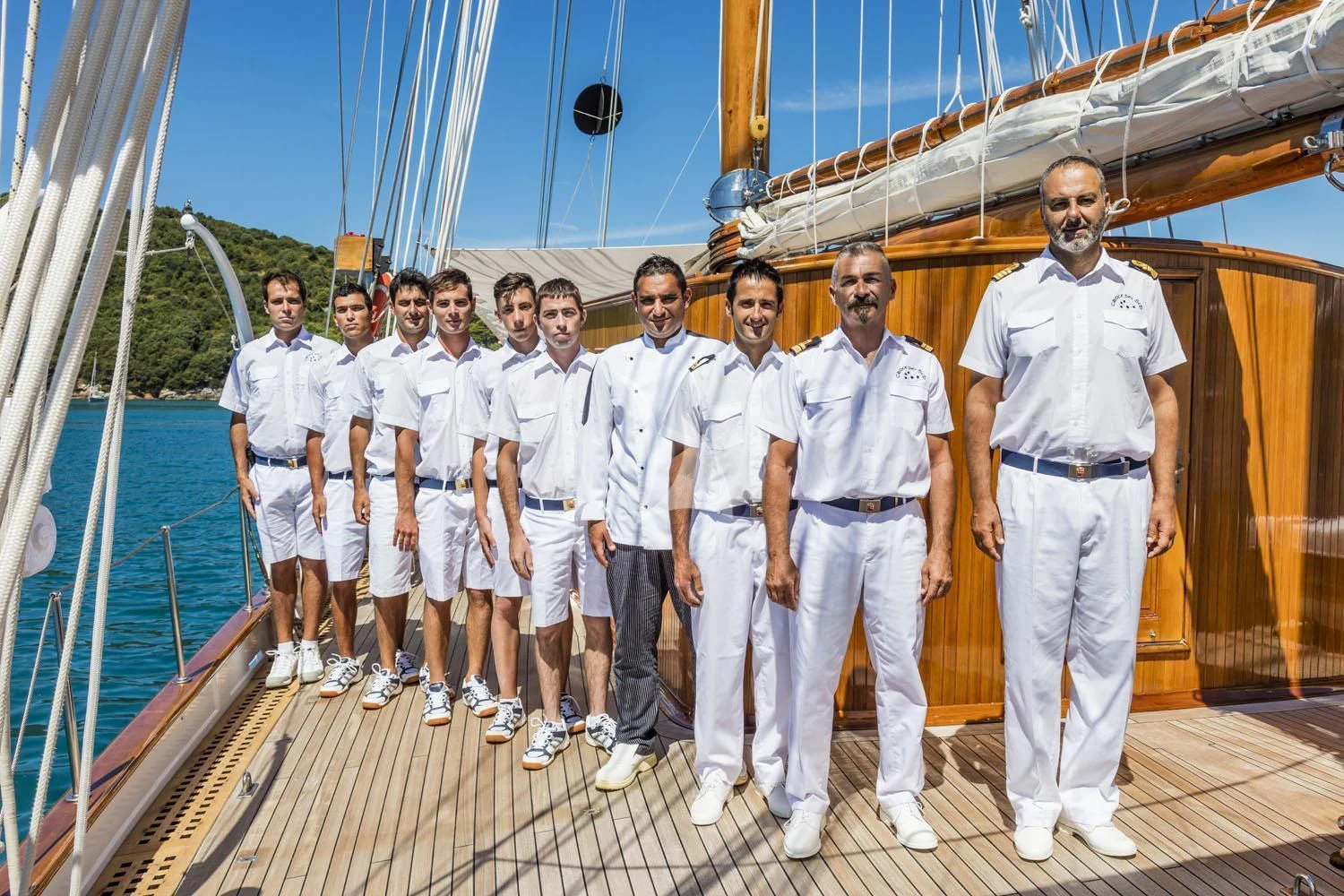 a group of people in uniform standing on a deck aboard CROCE DEL SUD Yacht for Sale
