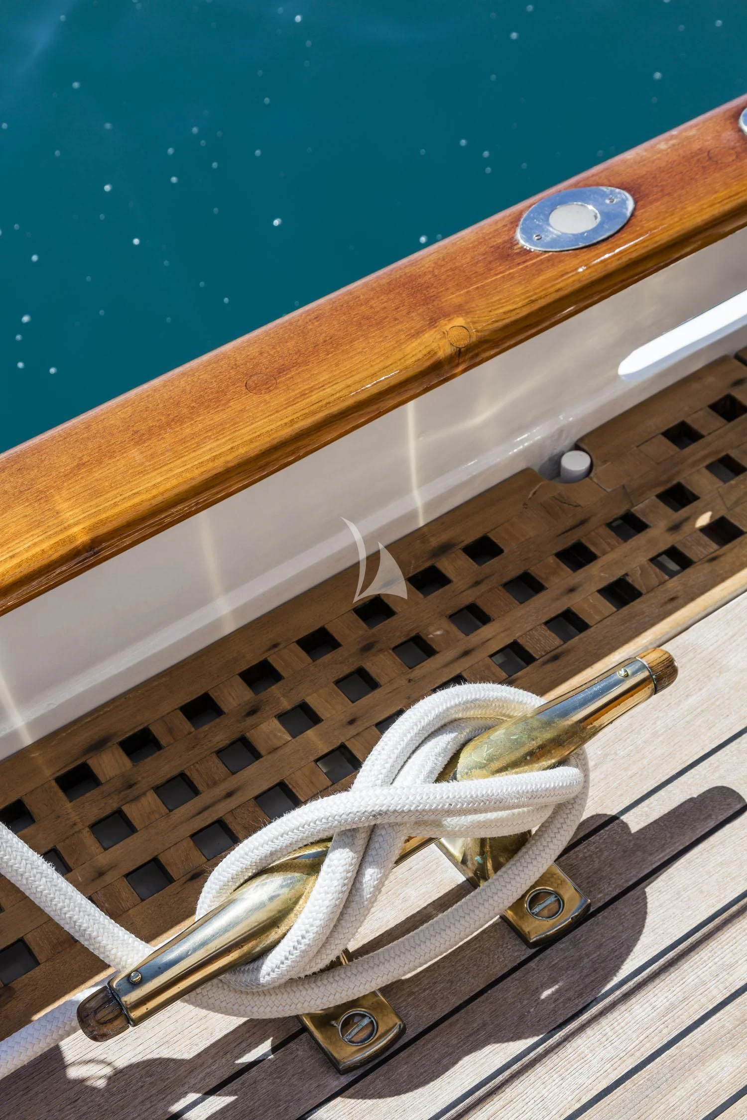 a metal object on a wooden surface aboard CROCE DEL SUD Yacht for Sale