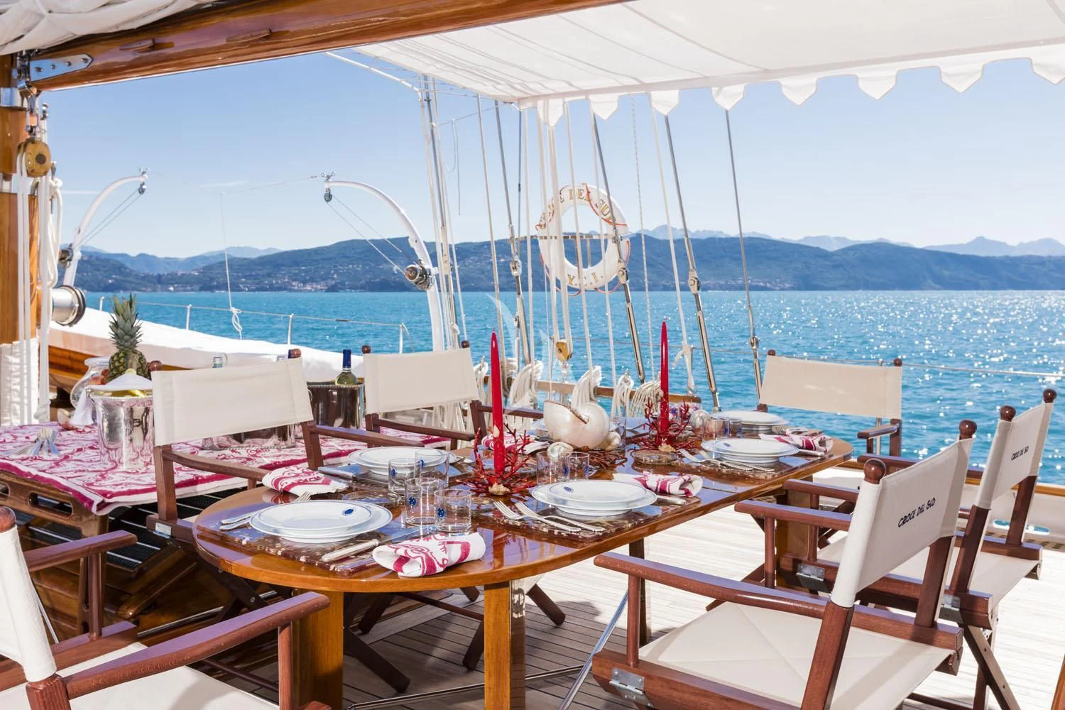 a table set for a dinner on a boat aboard CROCE DEL SUD Yacht for Sale