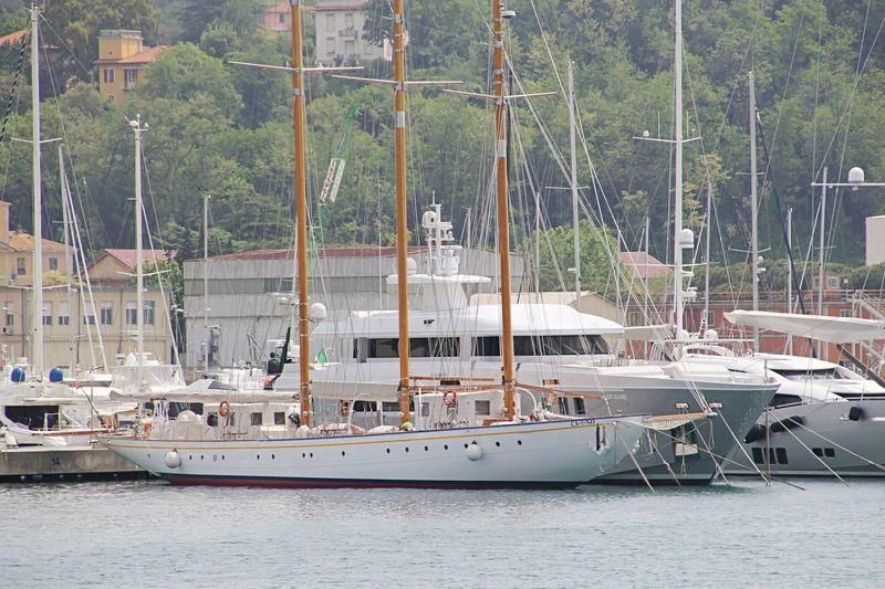 a large white boat in a harbor aboard CROCE DEL SUD Yacht for Sale