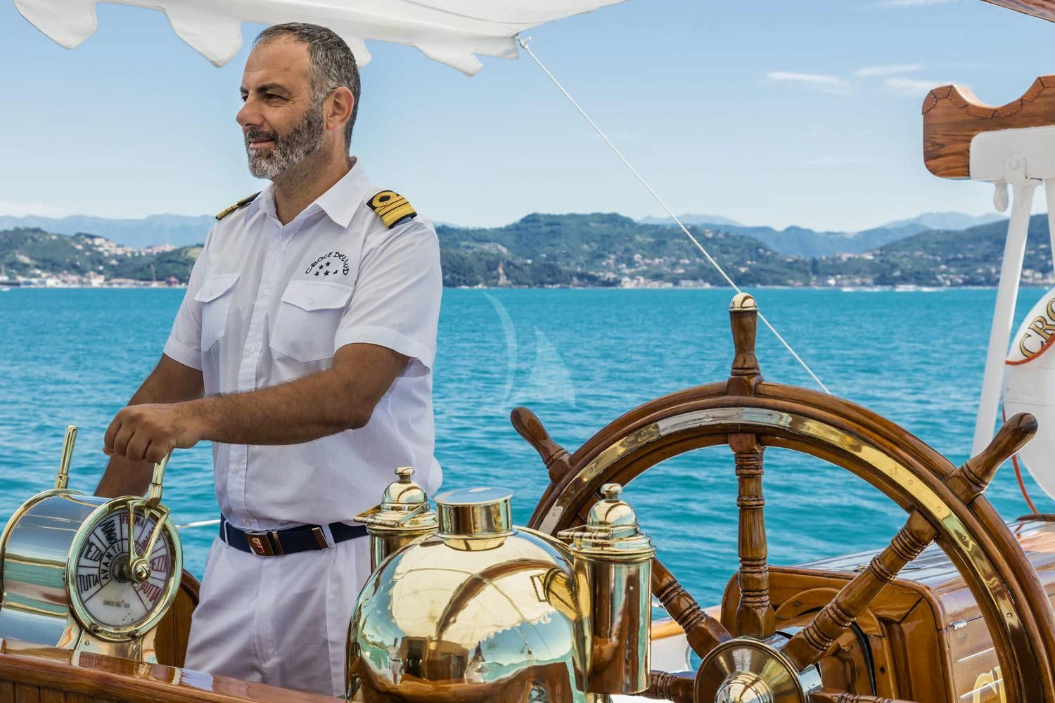 a man standing on a boat aboard CROCE DEL SUD Yacht for Sale