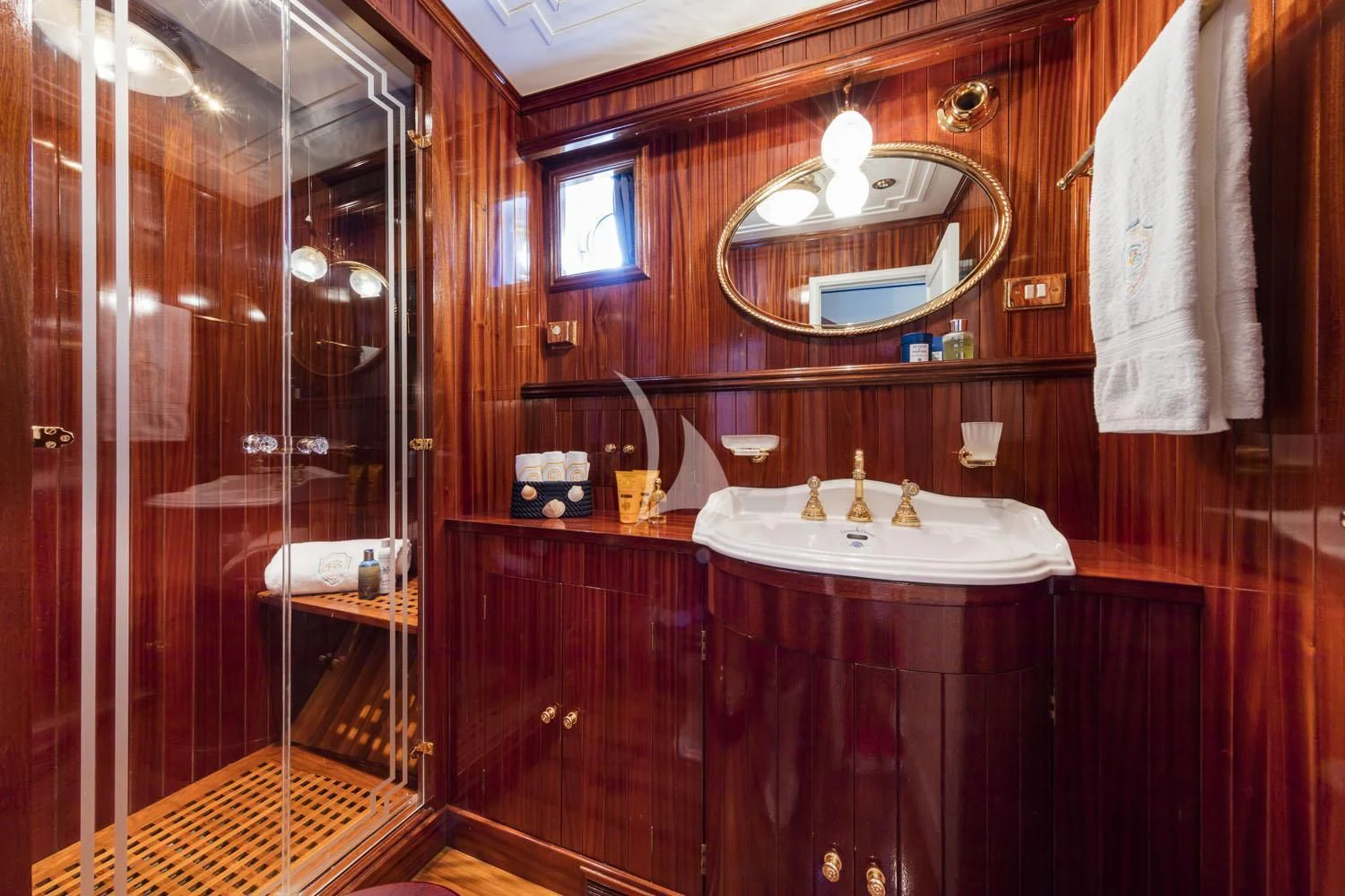 a bathroom with a sink and mirror aboard CROCE DEL SUD Yacht for Sale