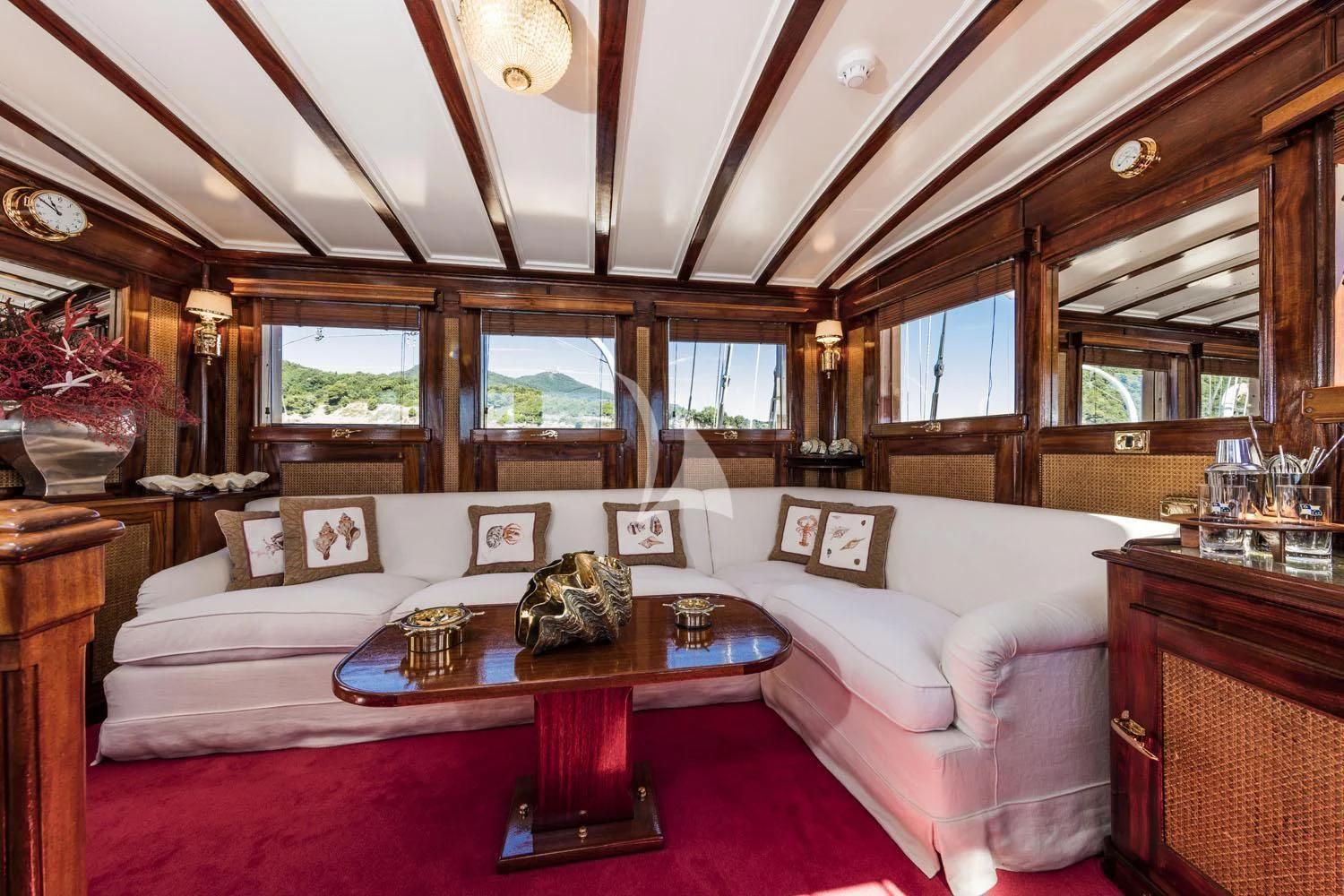 a living room with a large sofa aboard CROCE DEL SUD Yacht for Sale
