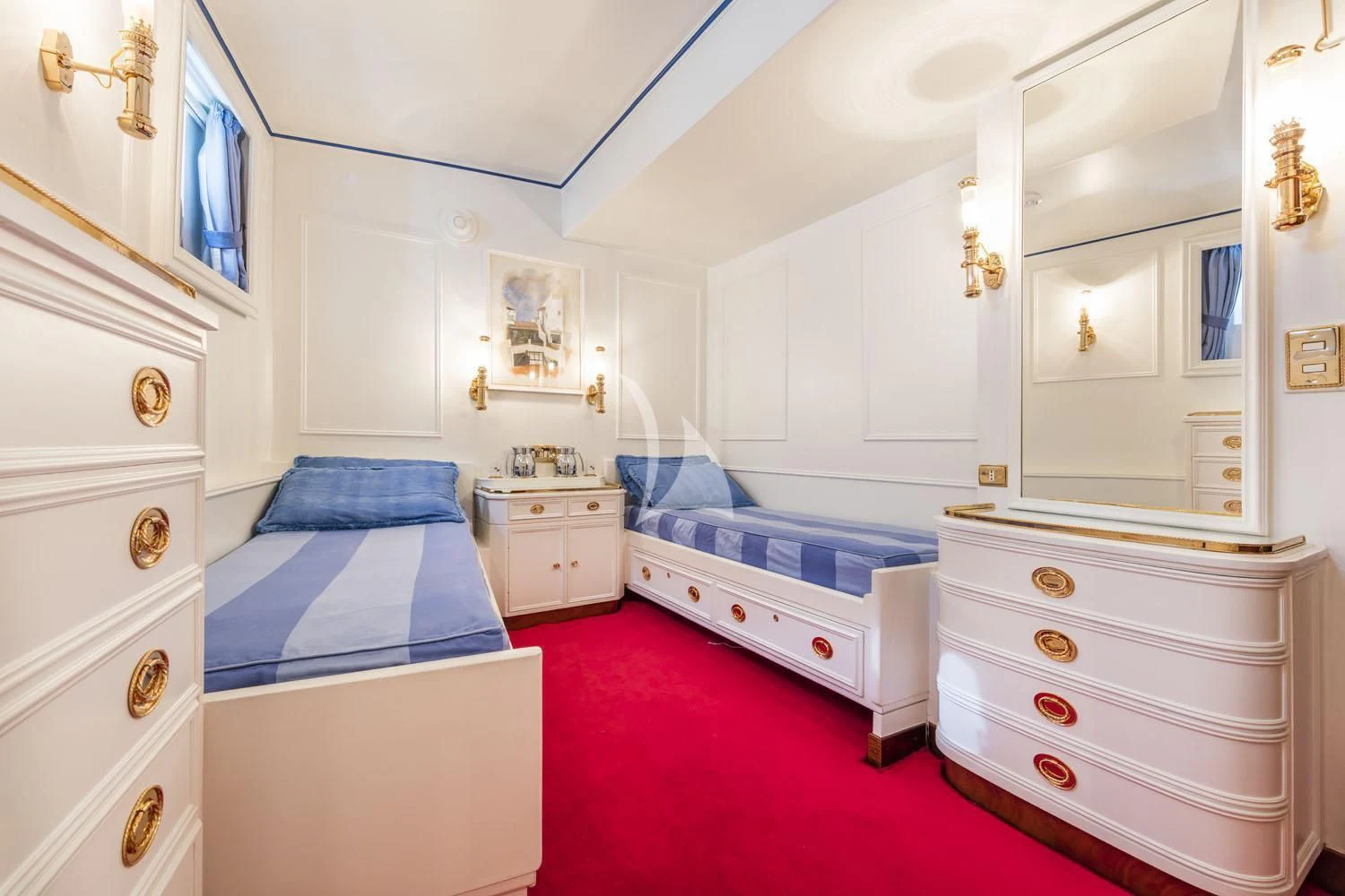 a bedroom with a red rug aboard CROCE DEL SUD Yacht for Sale