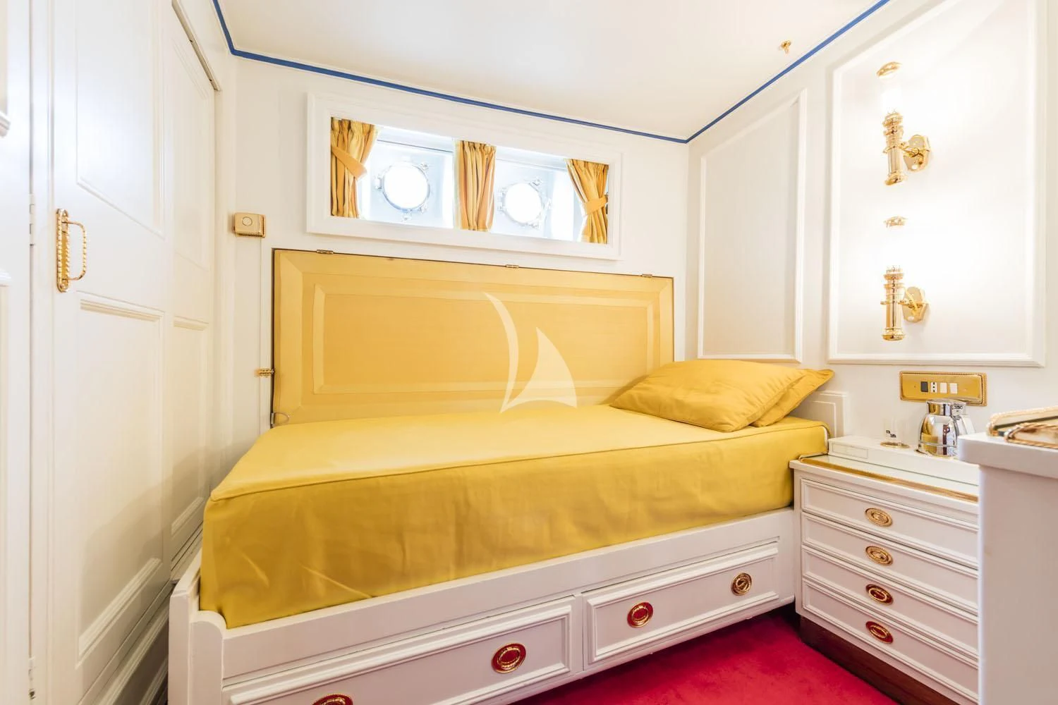 a bedroom with a bed and a dresser aboard CROCE DEL SUD Yacht for Sale