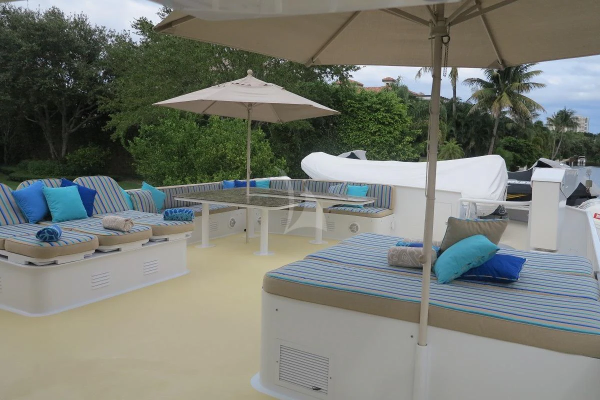 a pool with lounge chairs and umbrellas aboard LE MONTRACHET Yacht for Sale